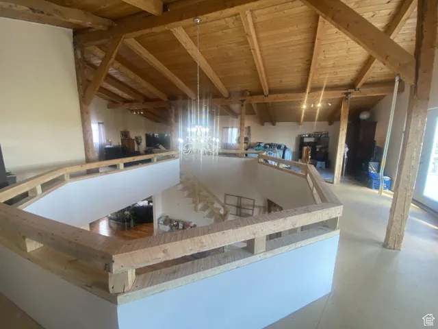 Kitchen featuring wooden ceiling and concrete flooring
