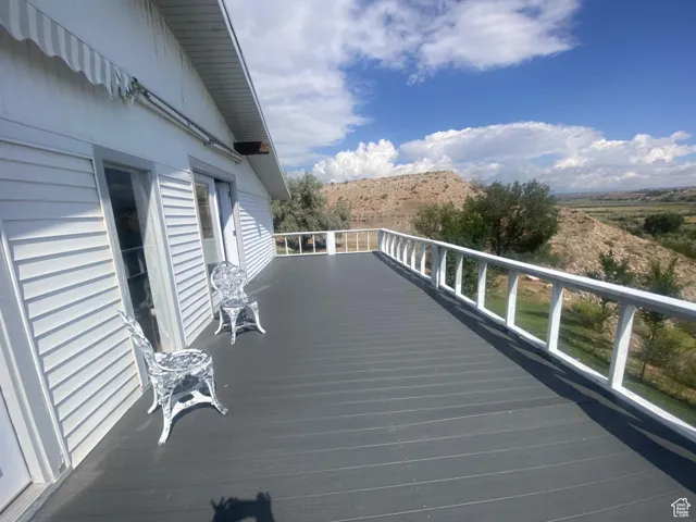 Wooden terrace featuring a mountain view