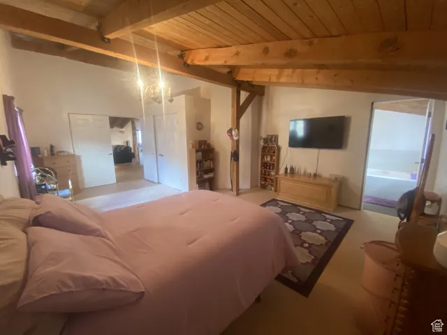 Bedroom featuring wood ceiling