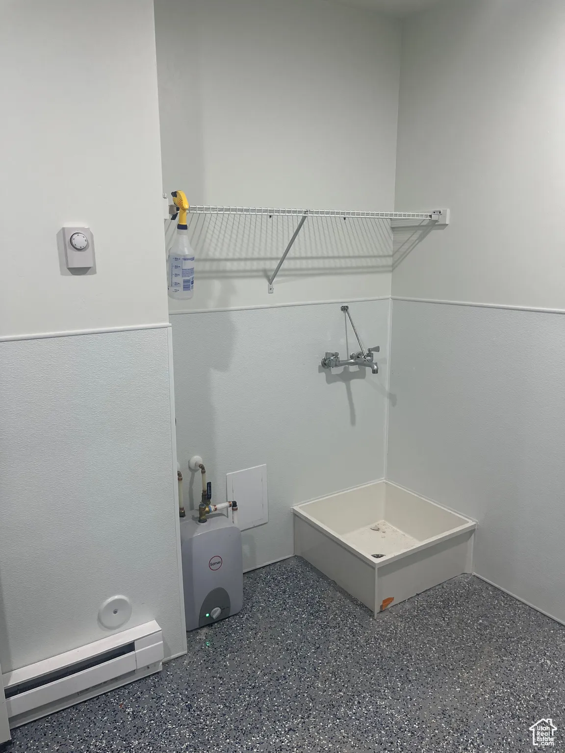 Bathroom with a baseboard heating unit