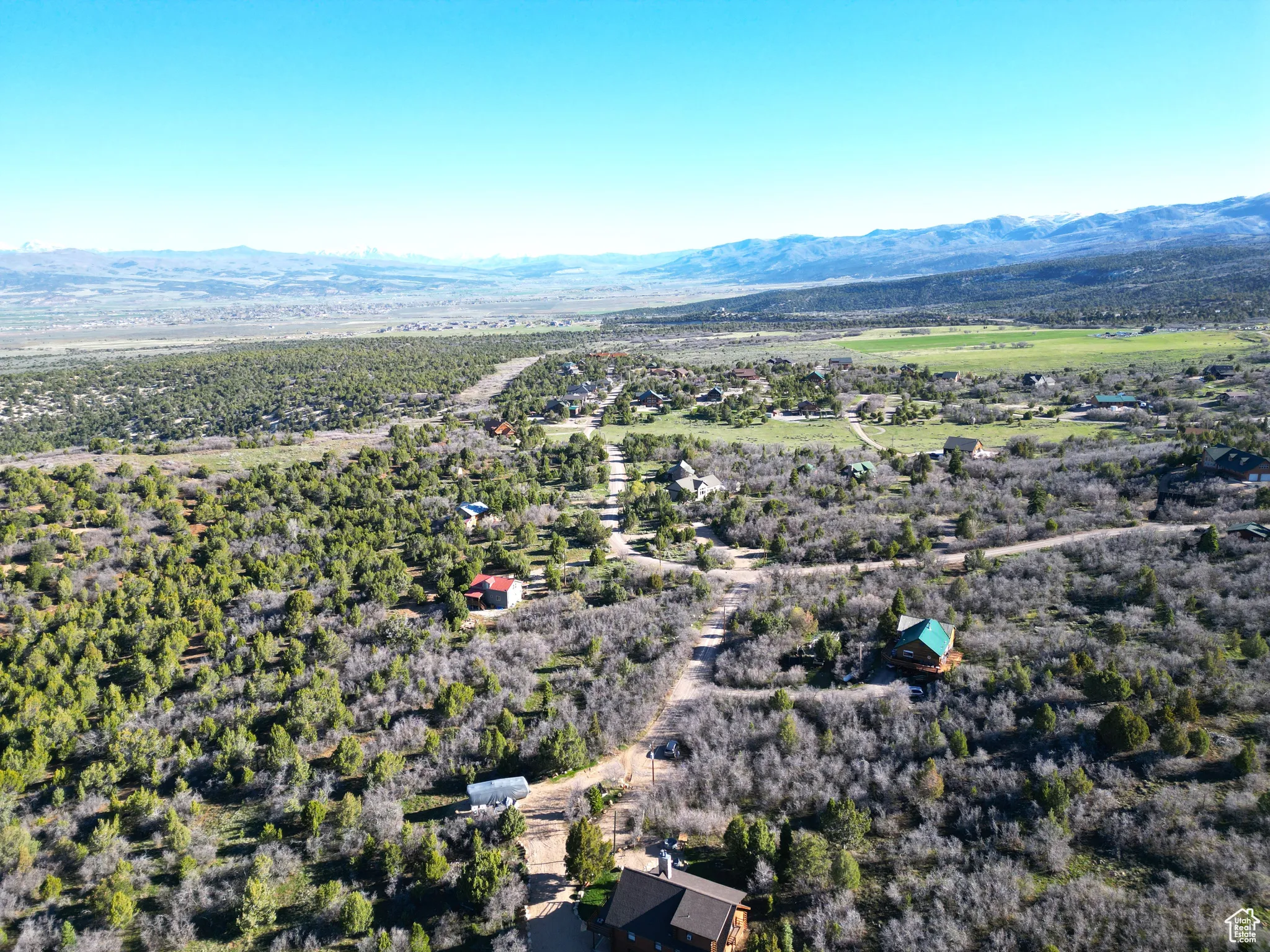 Aerial overview of property's location featuring mountains