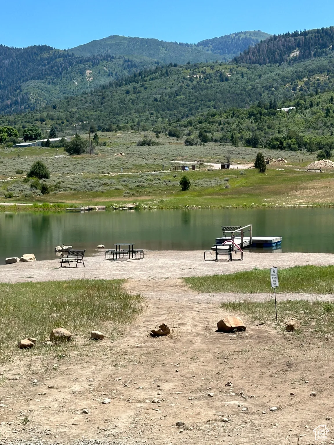 View of home's community with a water and mountain view
