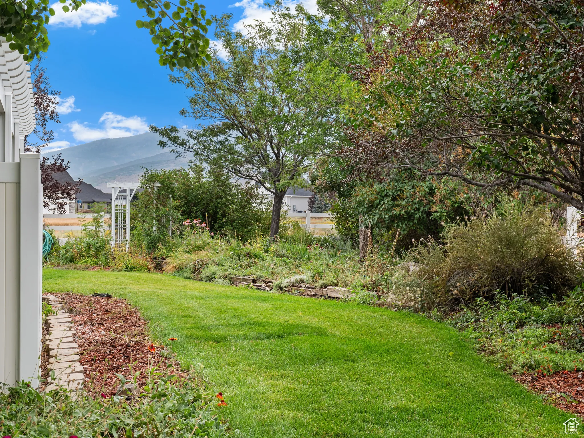 View of green lawn with a mountain view