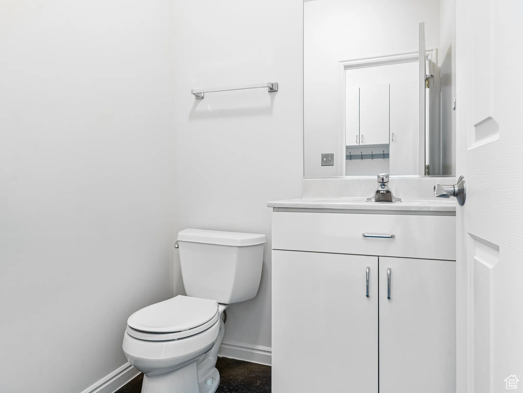 Half Bath in hall by the garage entrance