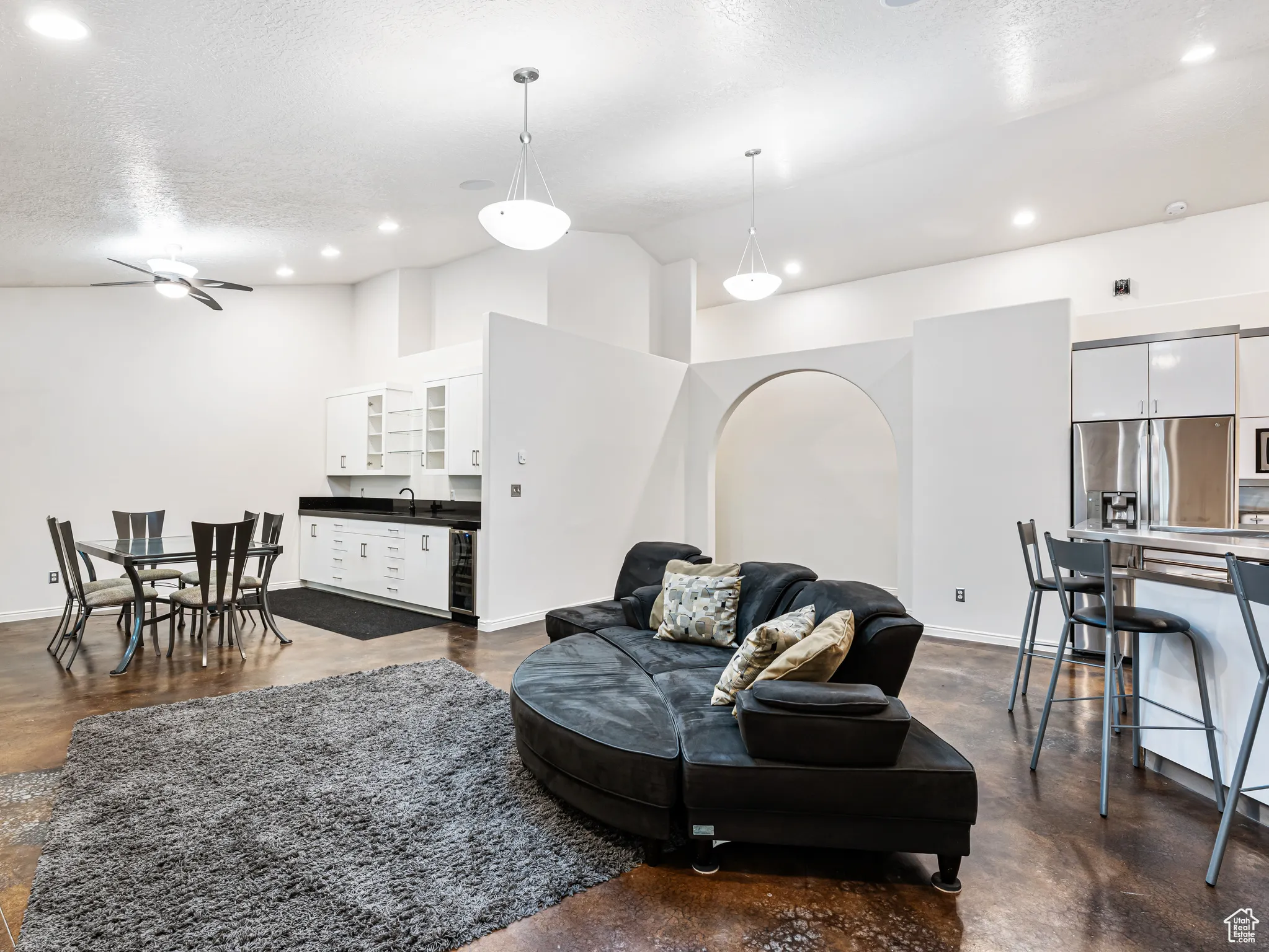 Great Room with Kitchen, Lounge Area and a larger Dining Area with a wet bar and Fridge.