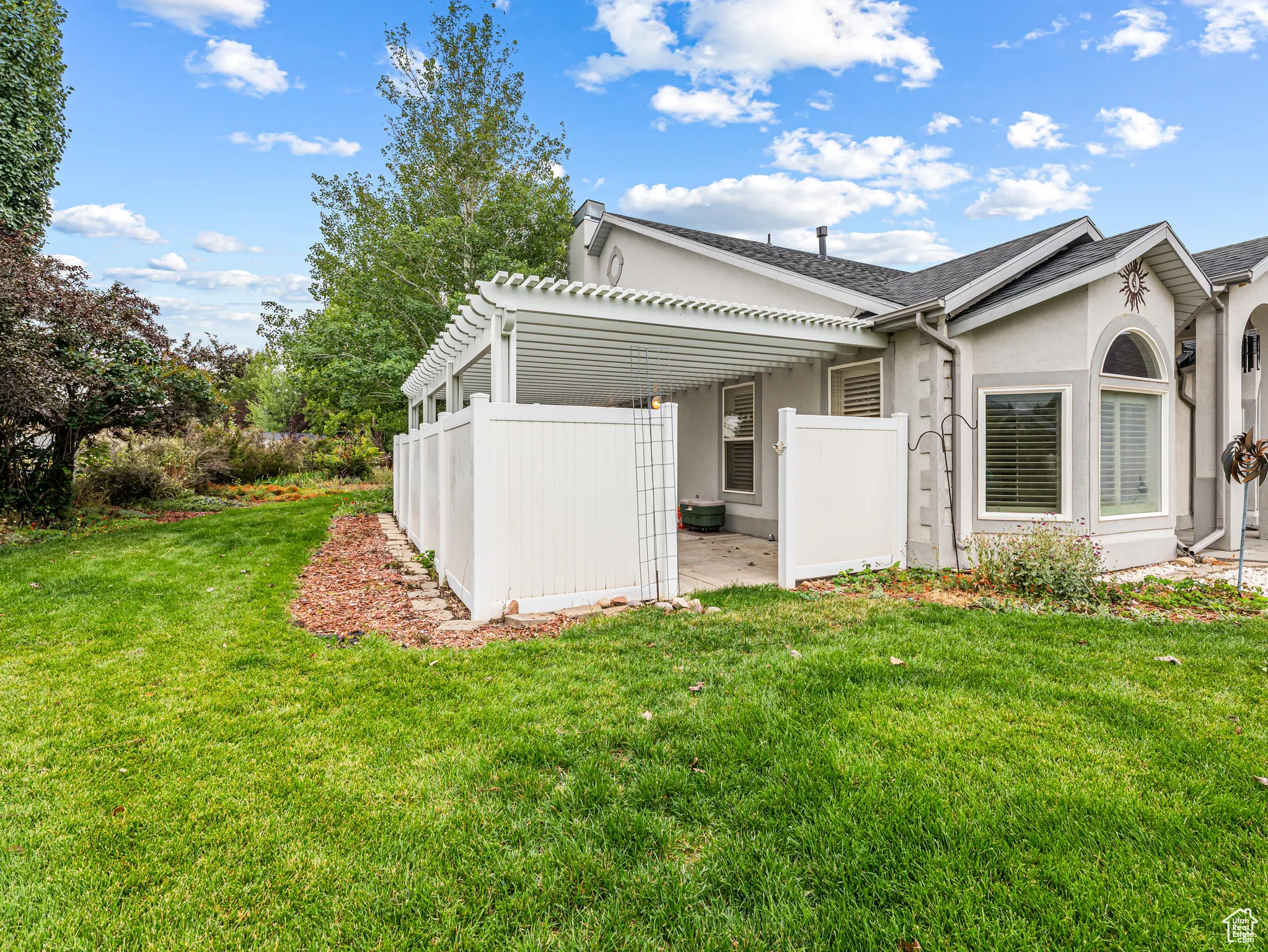 Sanctuary Patio off the Owner's Suite with privacy fence and pergola,,