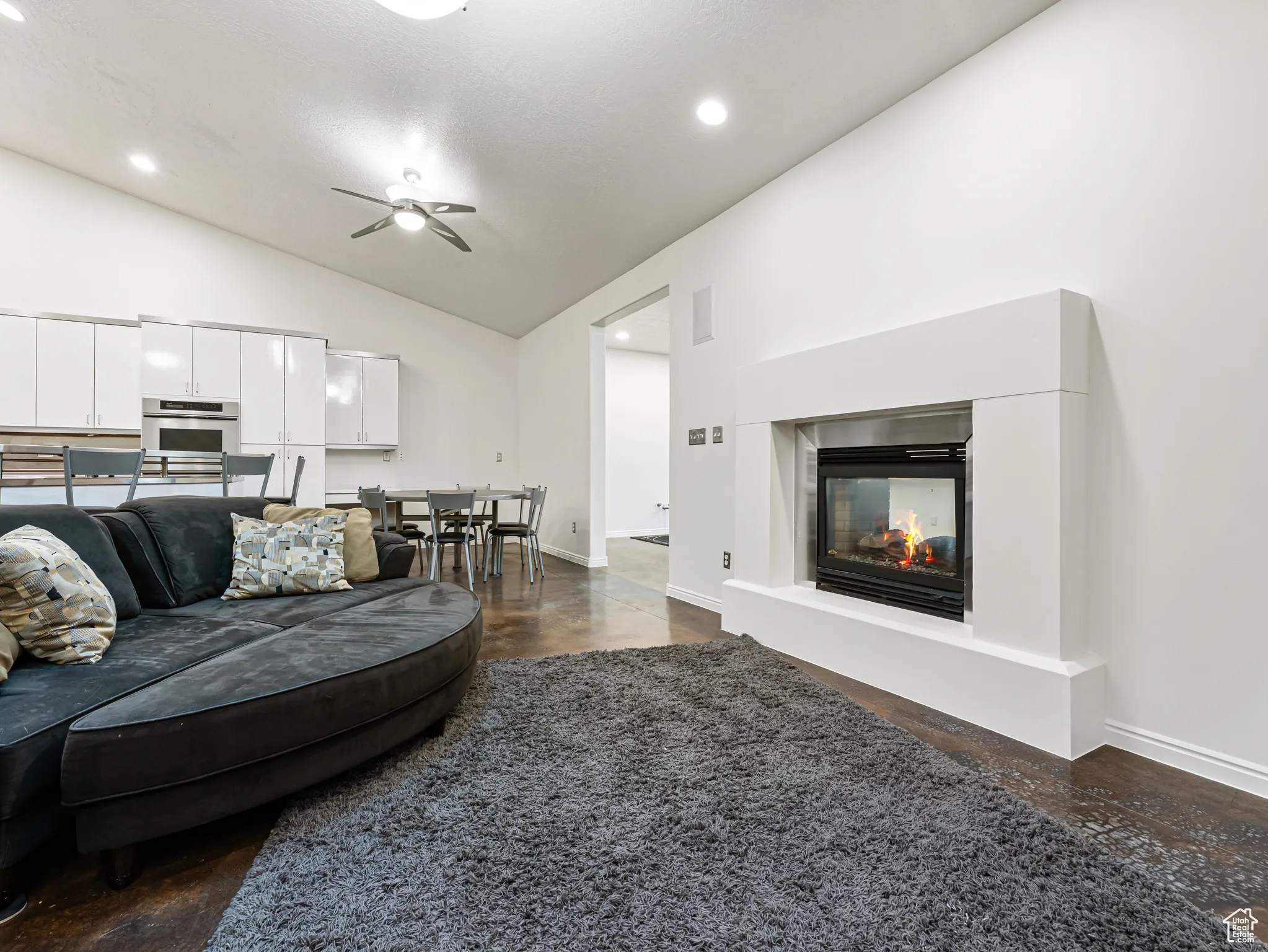 Great Room lounge area with a cozy double-sided fireplace, l