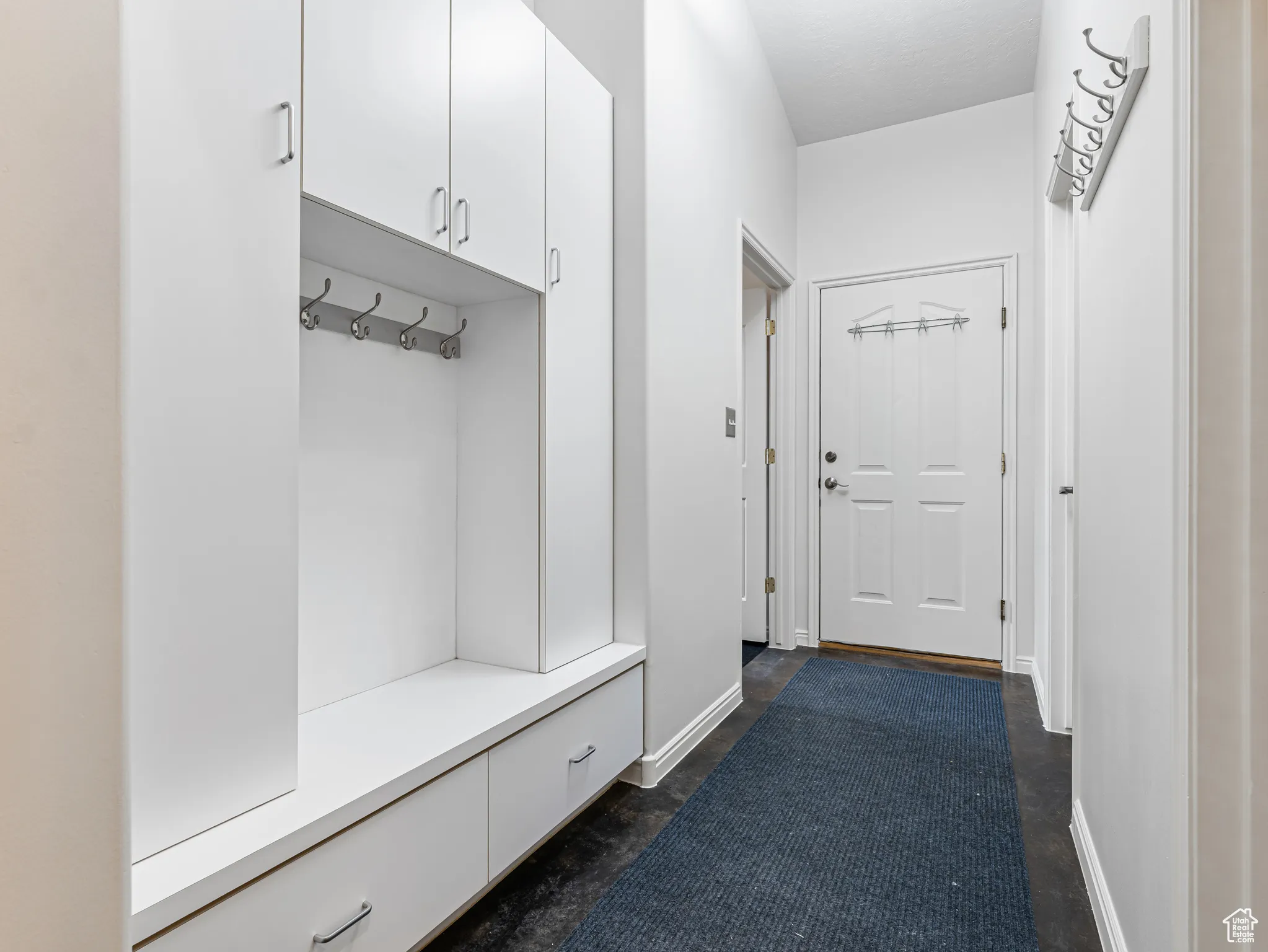 Garage Entrance with Laundry to the left, large Storage to the right,  Tons of storage and a 1/2 bath..