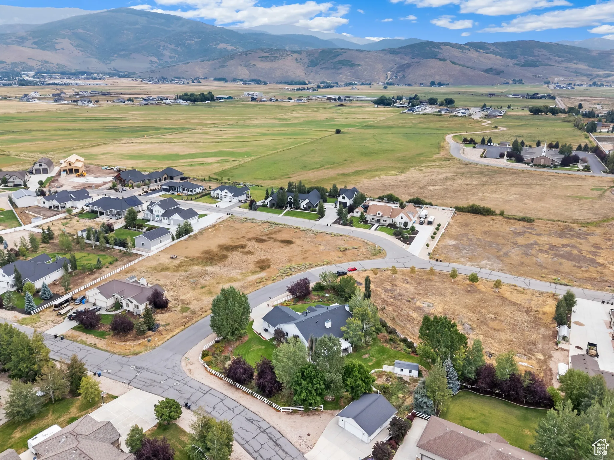 Aerial perspective of suburban area featuring a mountain backdrop