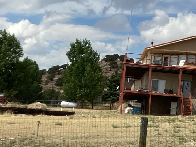 View of yard with a wooden deck
