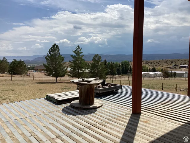 Deck featuring a mountain view and a view of countryside