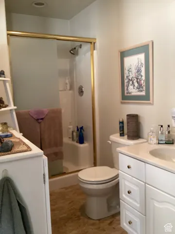 Bathroom with vanity and a shower stall