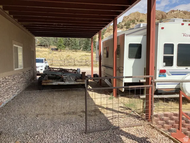View of patio featuring an attached carport and a mountain view