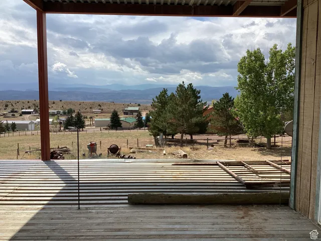 Deck with a mountain view and a view of rural / pastoral area