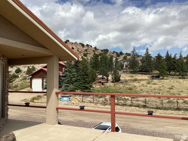 Exterior space featuring view of wooded area