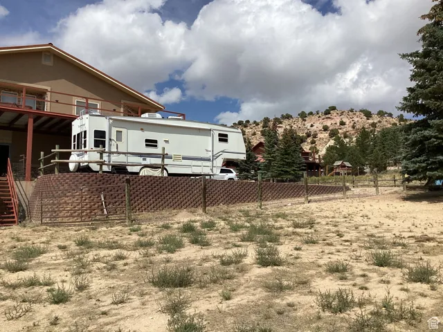 View of yard featuring a balcony