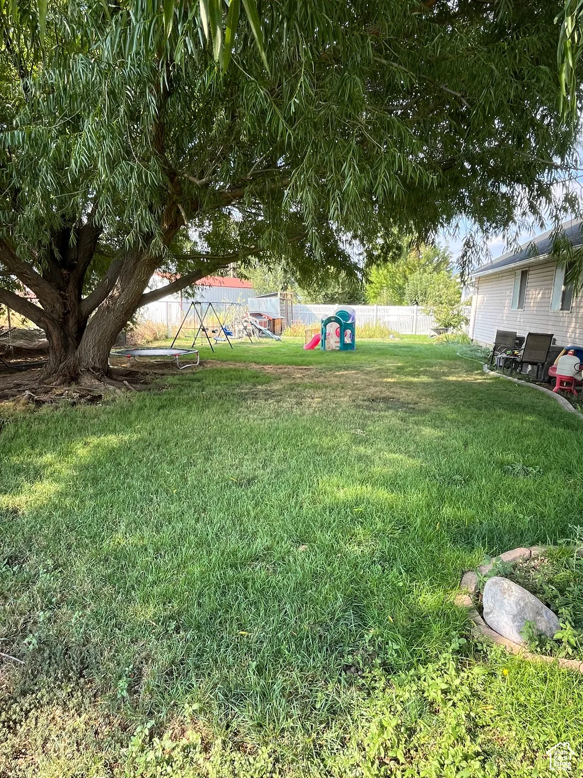 View of yard featuring a playground