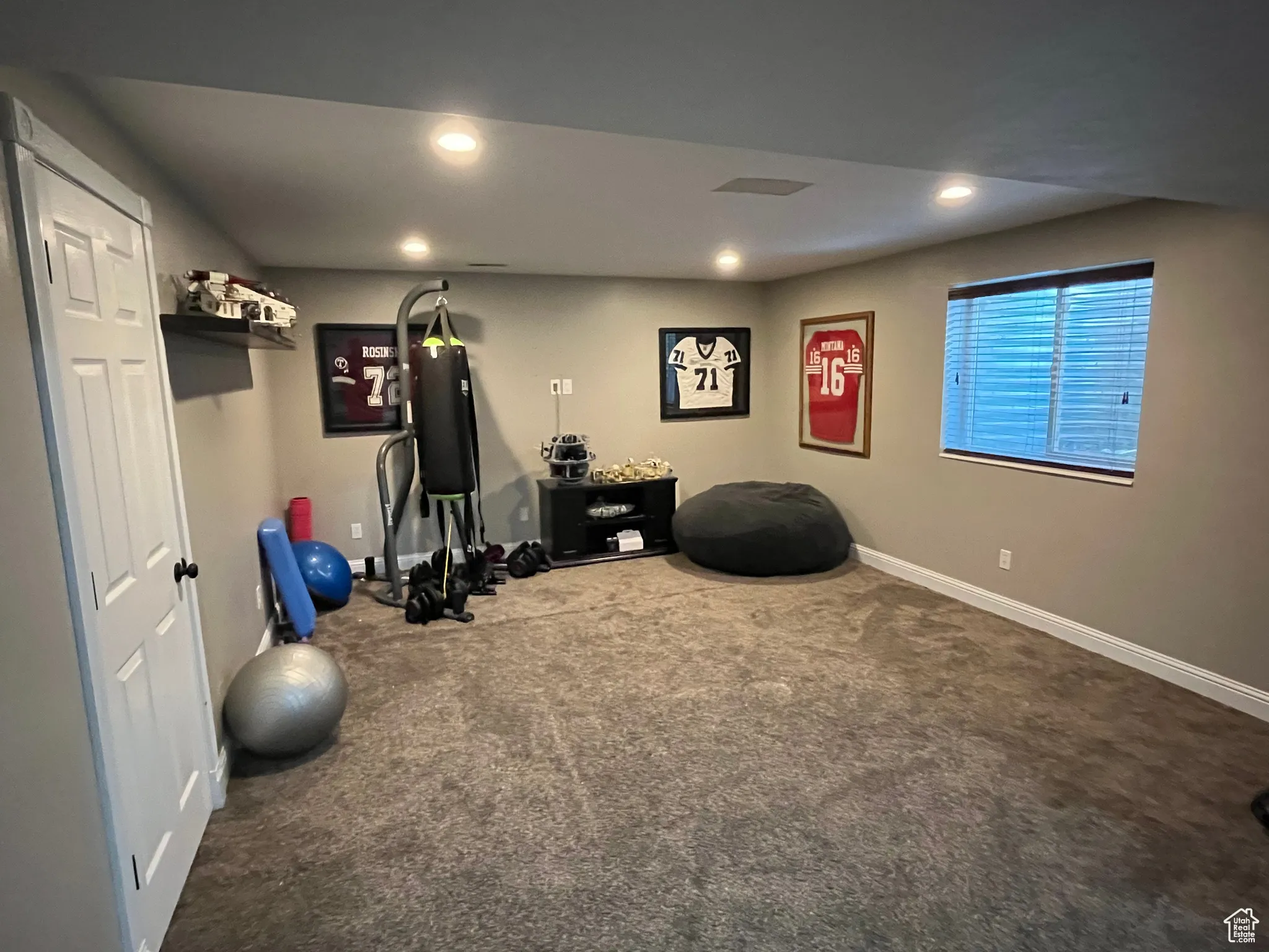 Workout area with carpet and recessed lighting