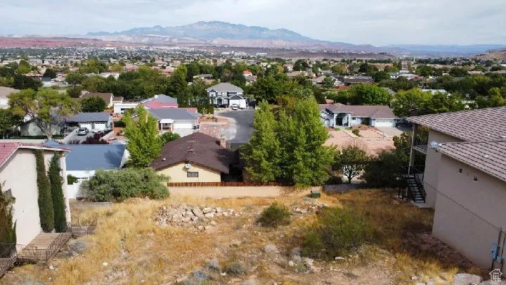 Aerial view of residential area with a mountain backdrop