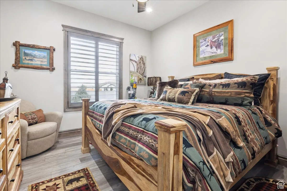 Bedroom featuring light wood finished floors and ceiling fan