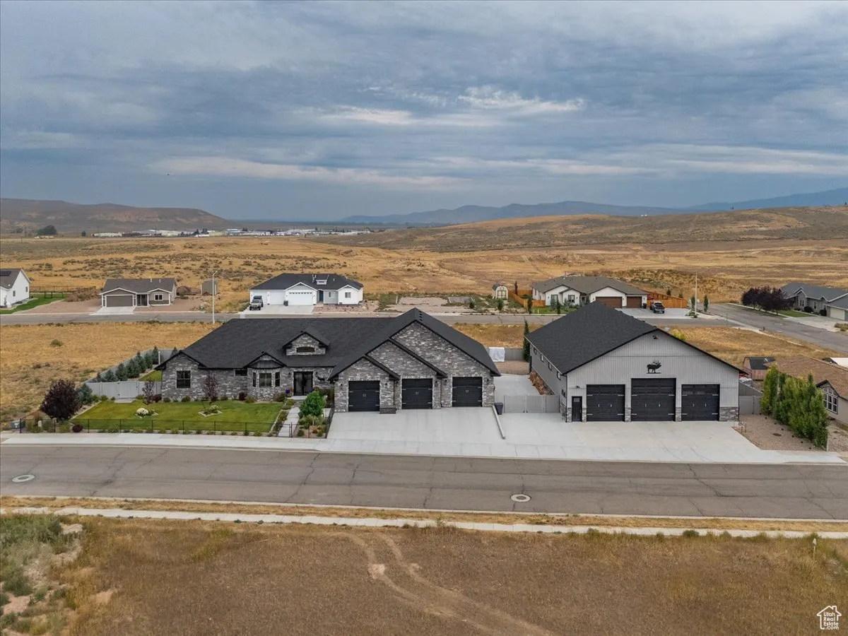View from above of property with a mountain backdrop