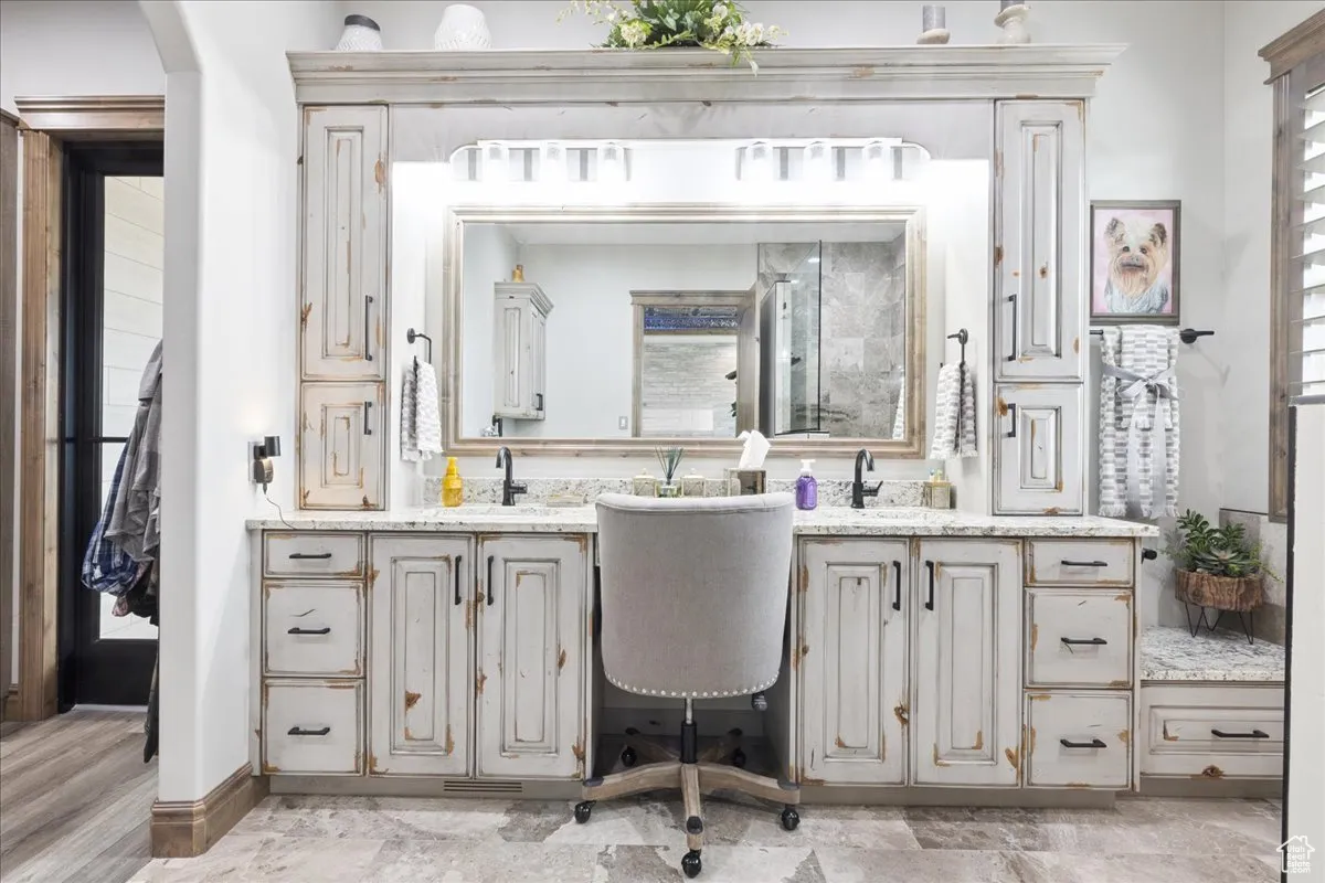 Bathroom with vanity and baseboards
