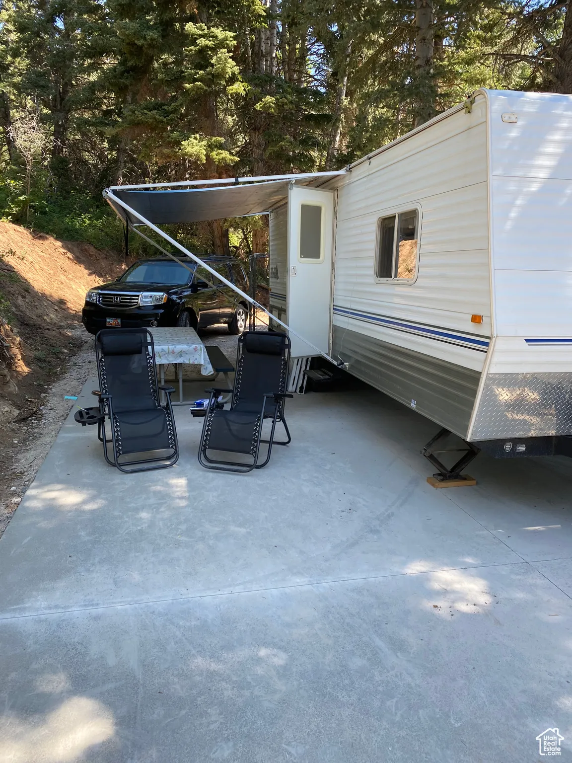 View of parking with trailer on it.