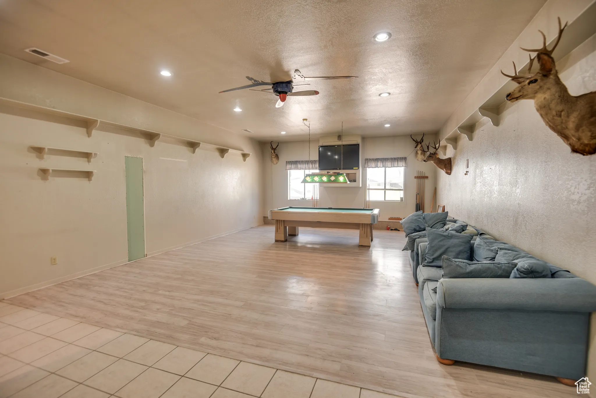 Rec room with pool table, ceiling fan, a textured ceiling, light wood finished floors, and recessed lighting