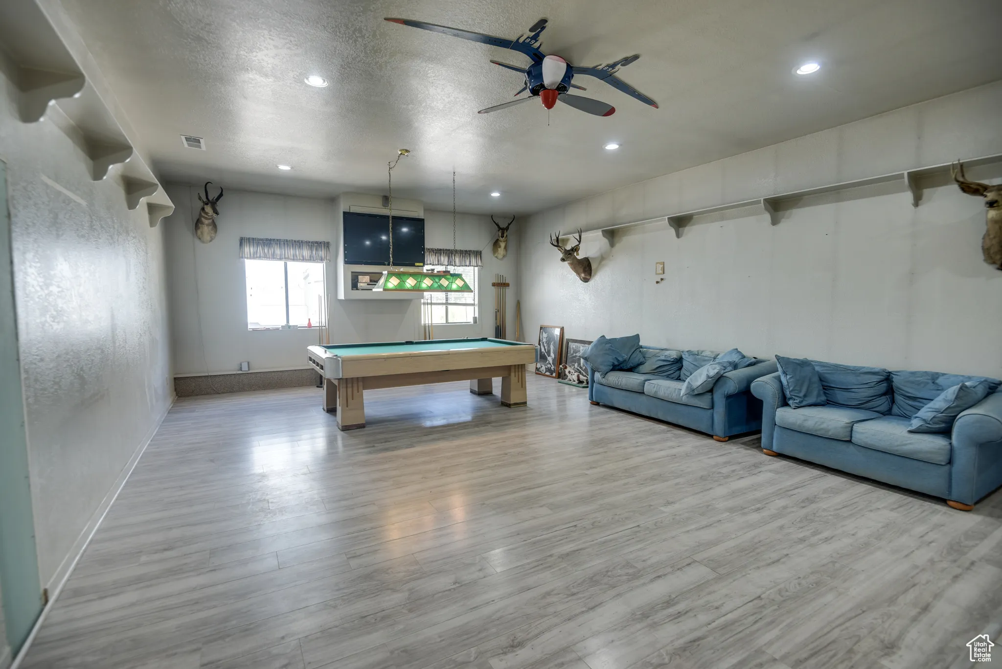 Recreation room with pool table, wood finished floors, a textured ceiling, a ceiling fan, and recessed lighting