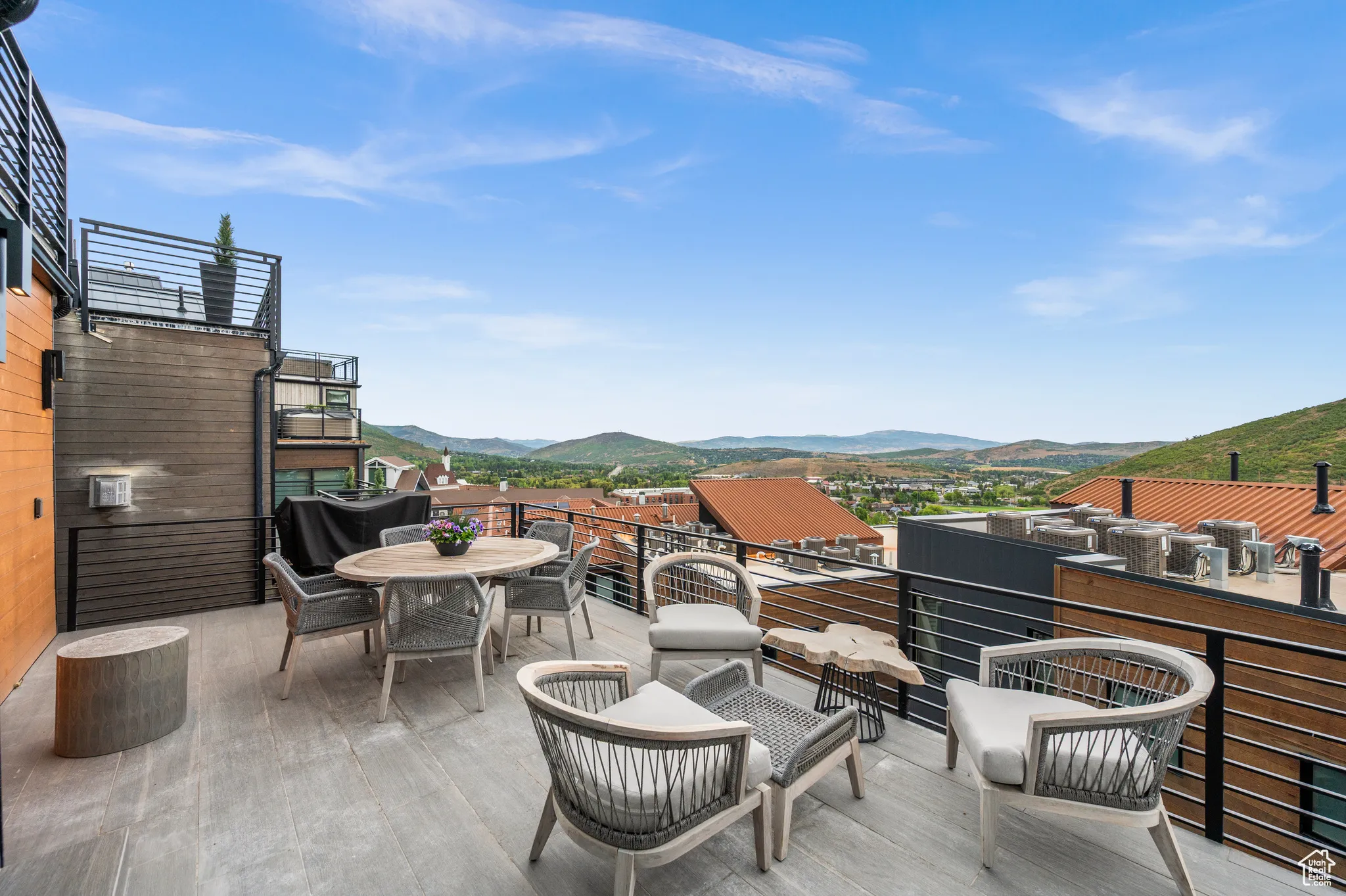 View of patio / terrace with a mountain view and outdoor dining area