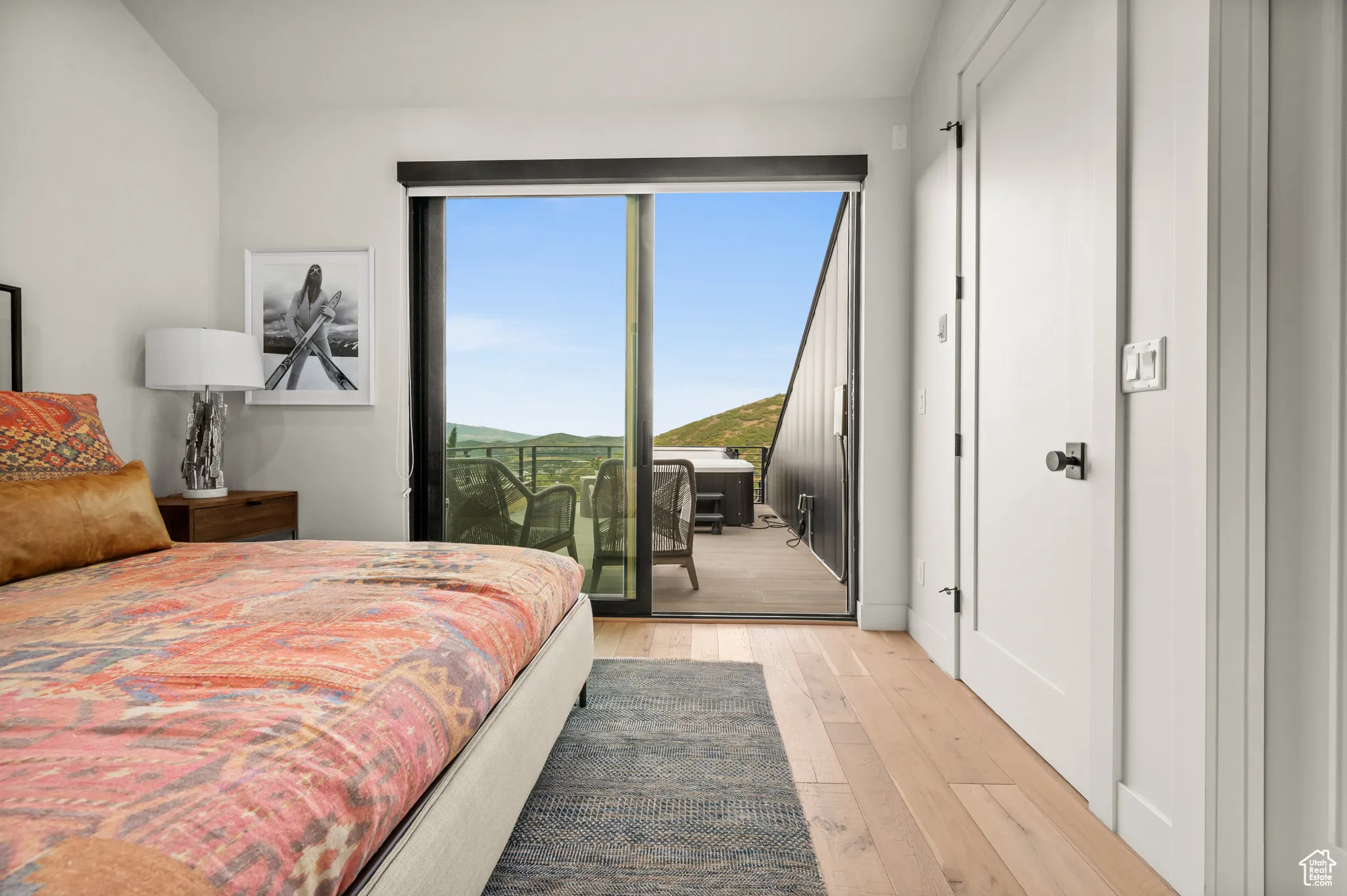 This ensuite bedroom enjoys direct access to the exquisite rooftop deck.