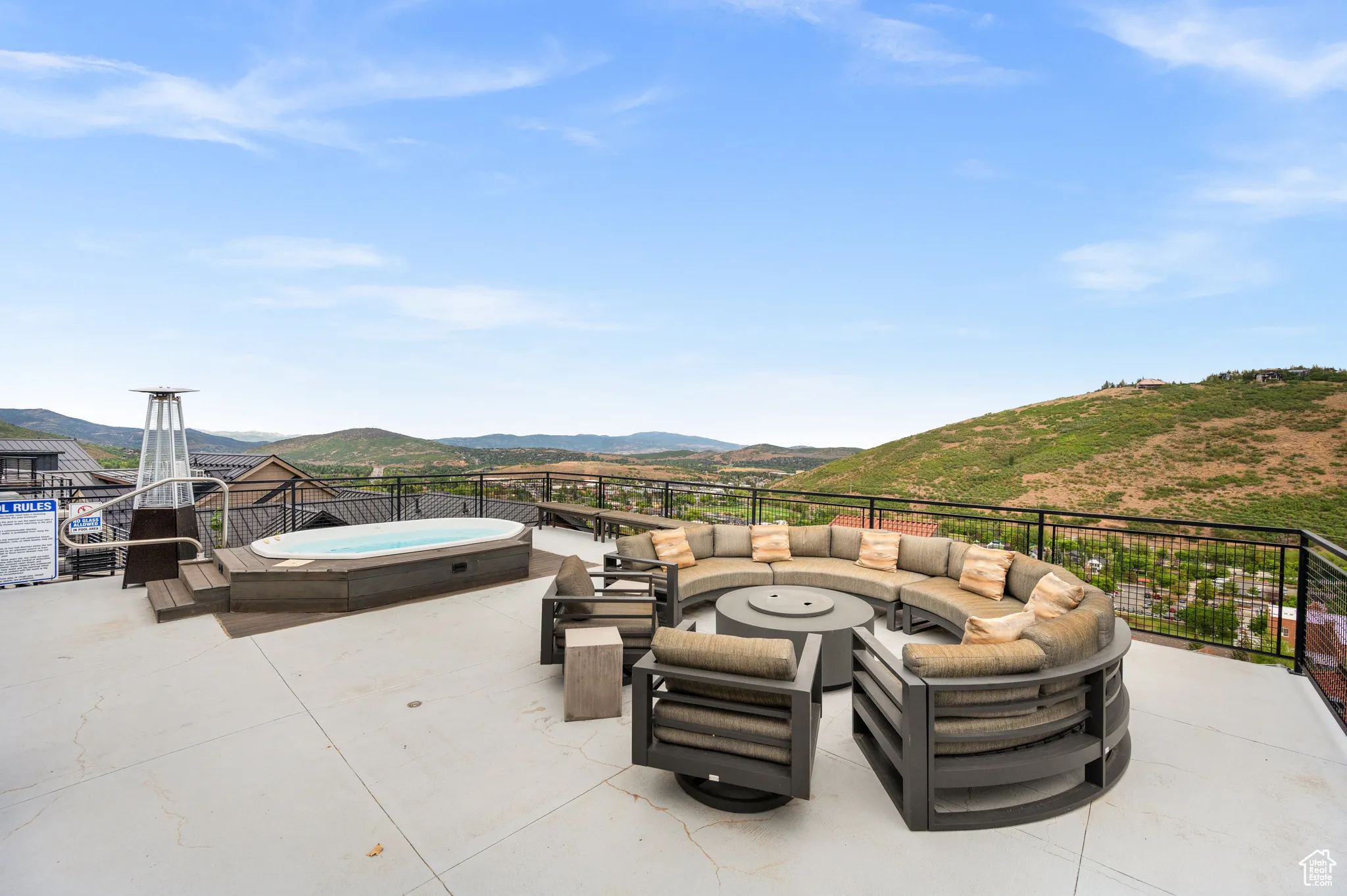 Additionally, groups of people can warm up on the tower's third floor and open air deck in its large hot tub or sitting by the fire pit on the cozy couch.