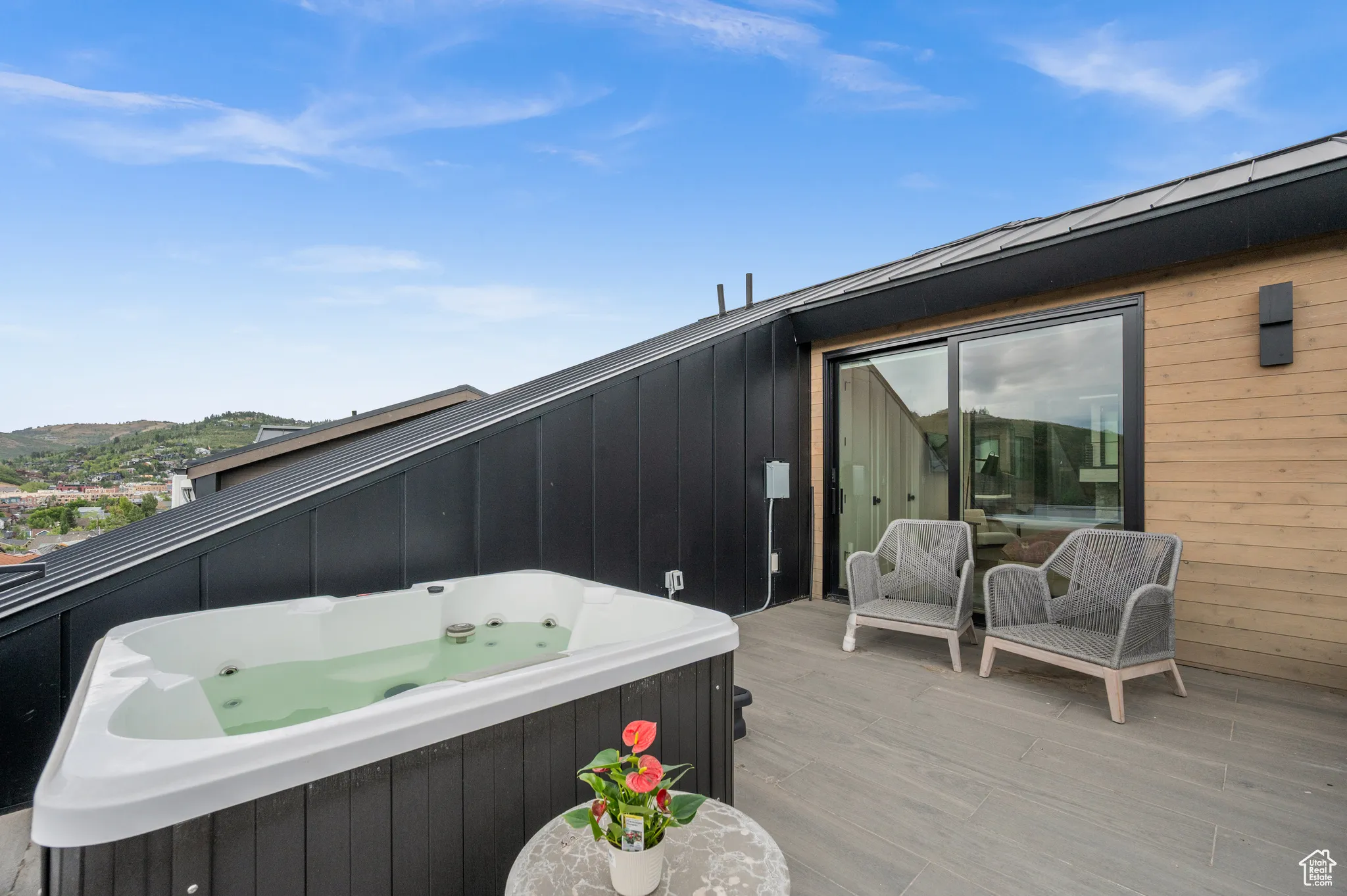 Whether sitting in chairs or warming up in the hot tub, this space is an incredible sanctuary.