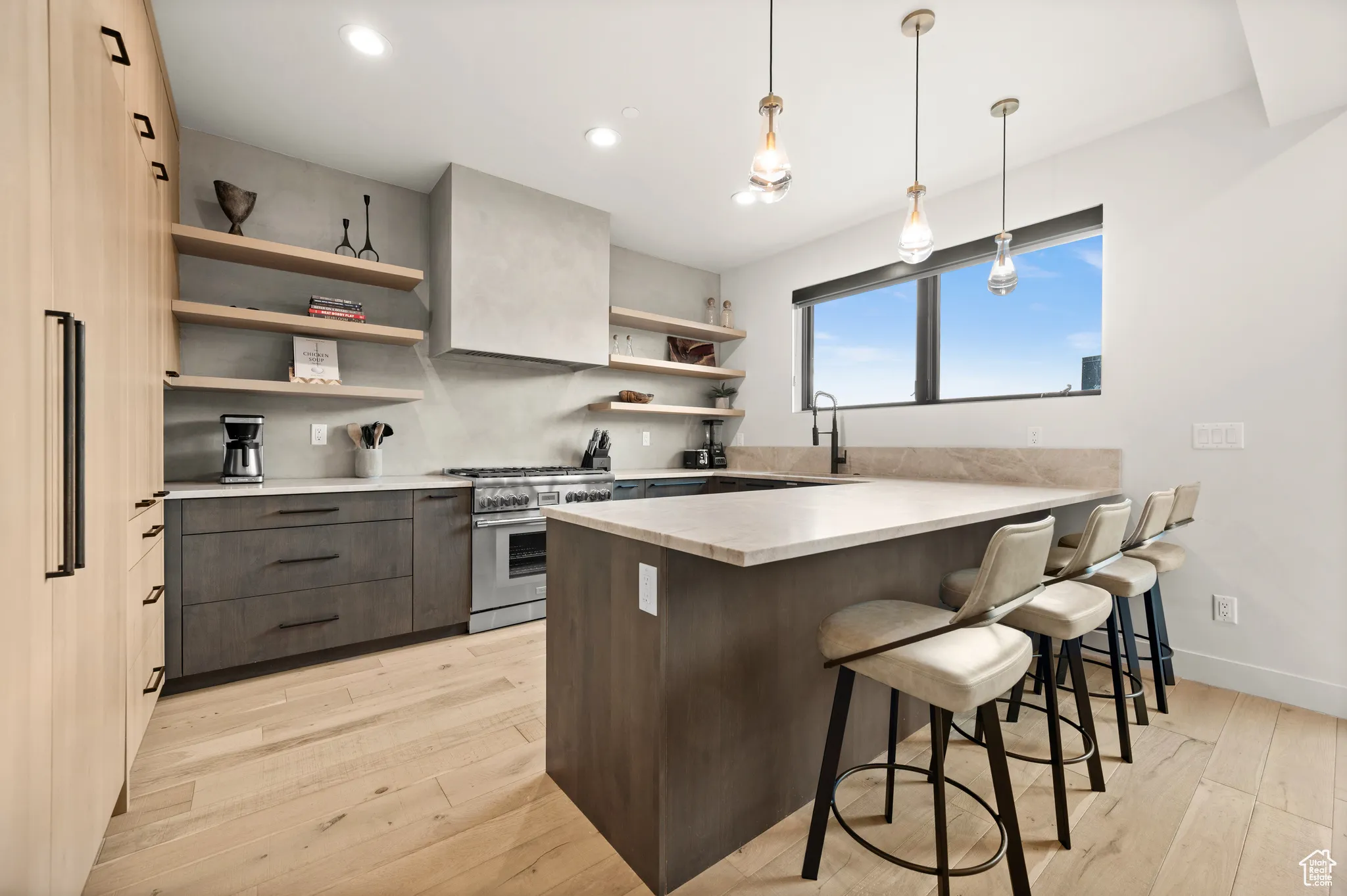 The kitchen has gorgeous quartz countertops and Thermador appliances.