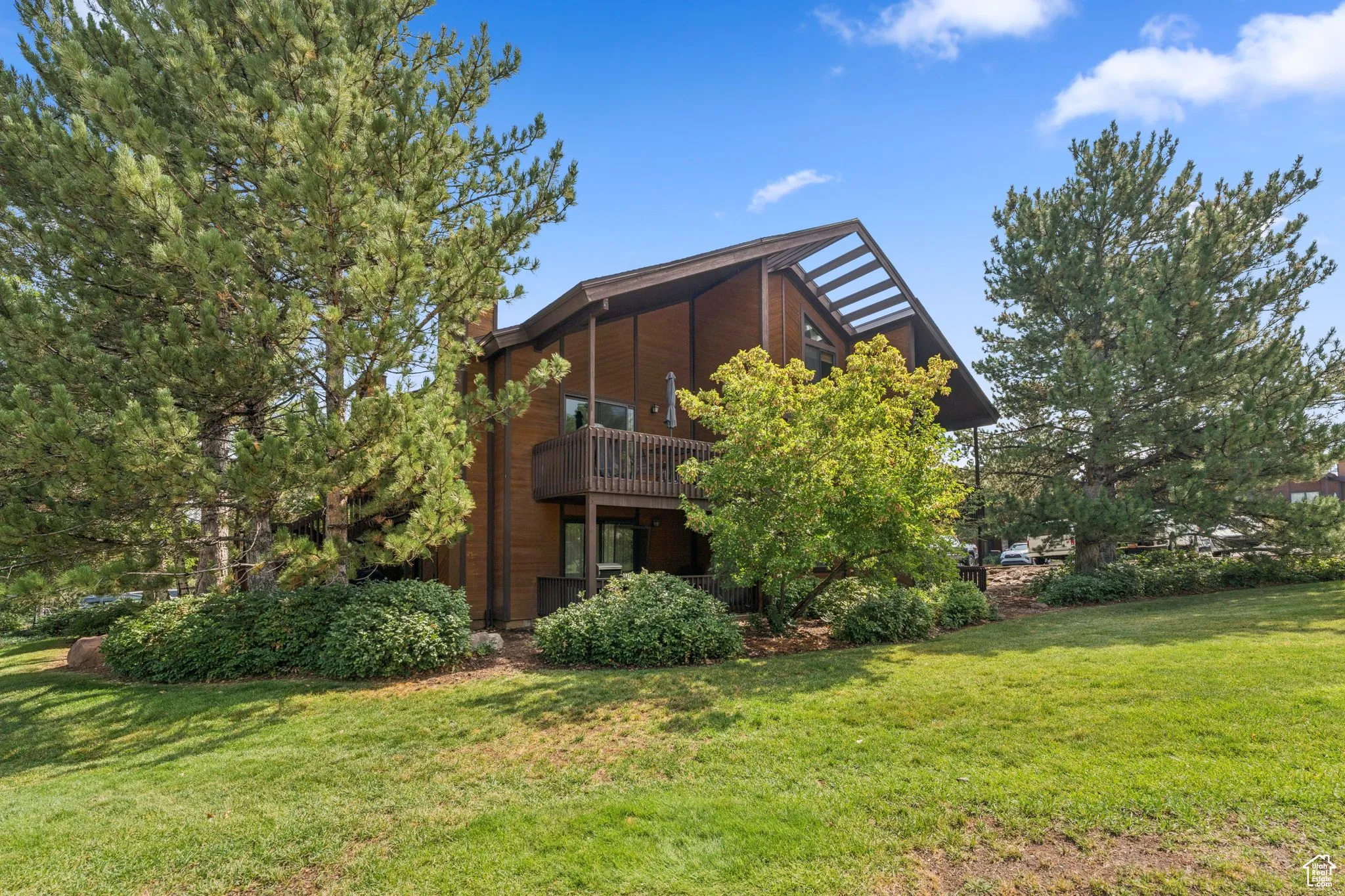 Back of house with a lawn