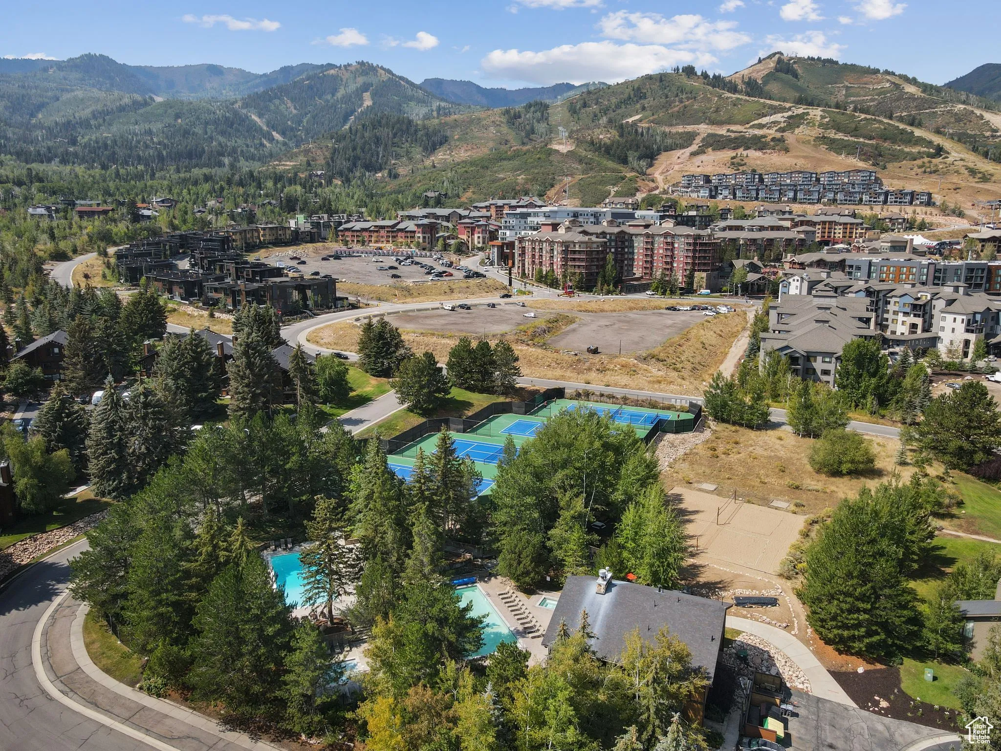 Aerial view of property's location with a mountain backdrop