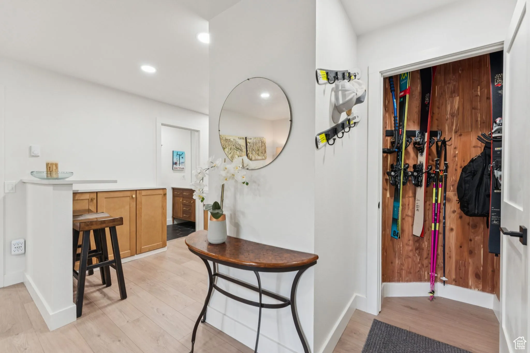 Corridor featuring light wood finished floors and recessed lighting