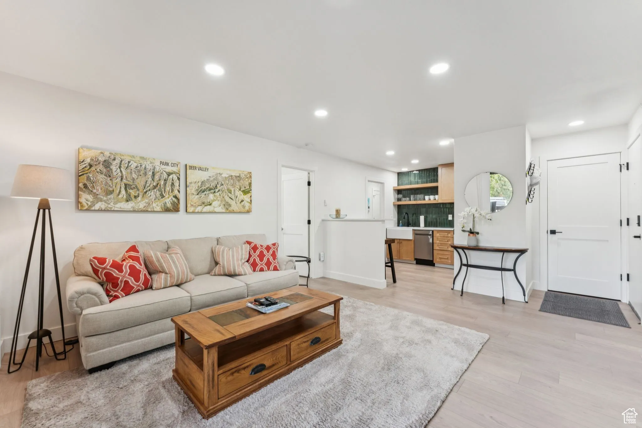 Living area featuring light wood-type flooring and recessed lighting