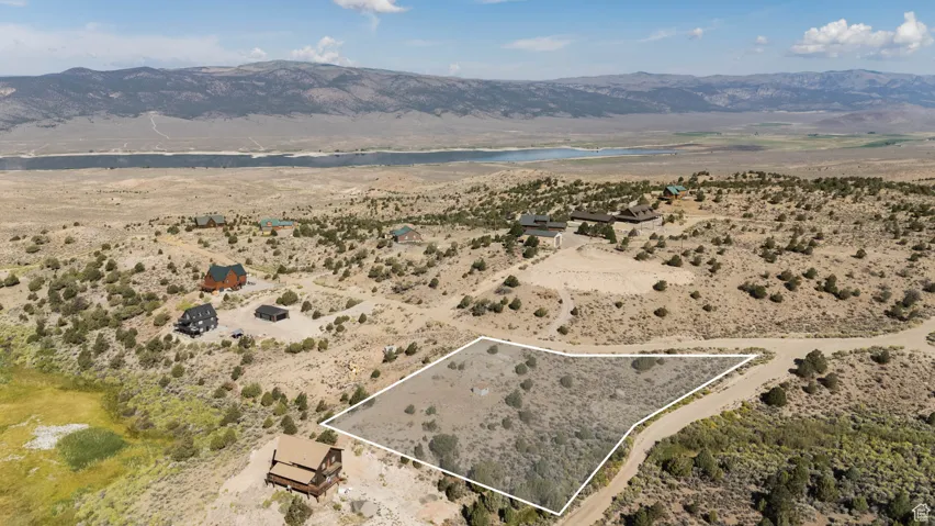 View of property location featuring property boundaries highlighted and a water and mountain view
