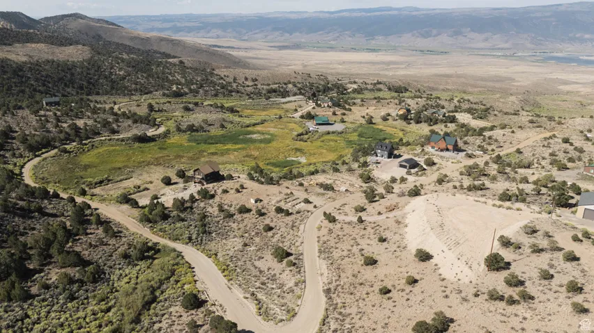 Aerial view of property's location with mountains and rural landscape