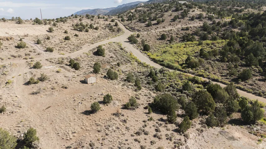 View of rural area with a desert landscape and a mountain backdrop