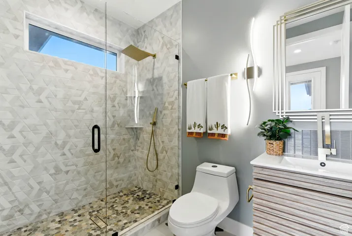 Bathroom with a stall shower and vanity