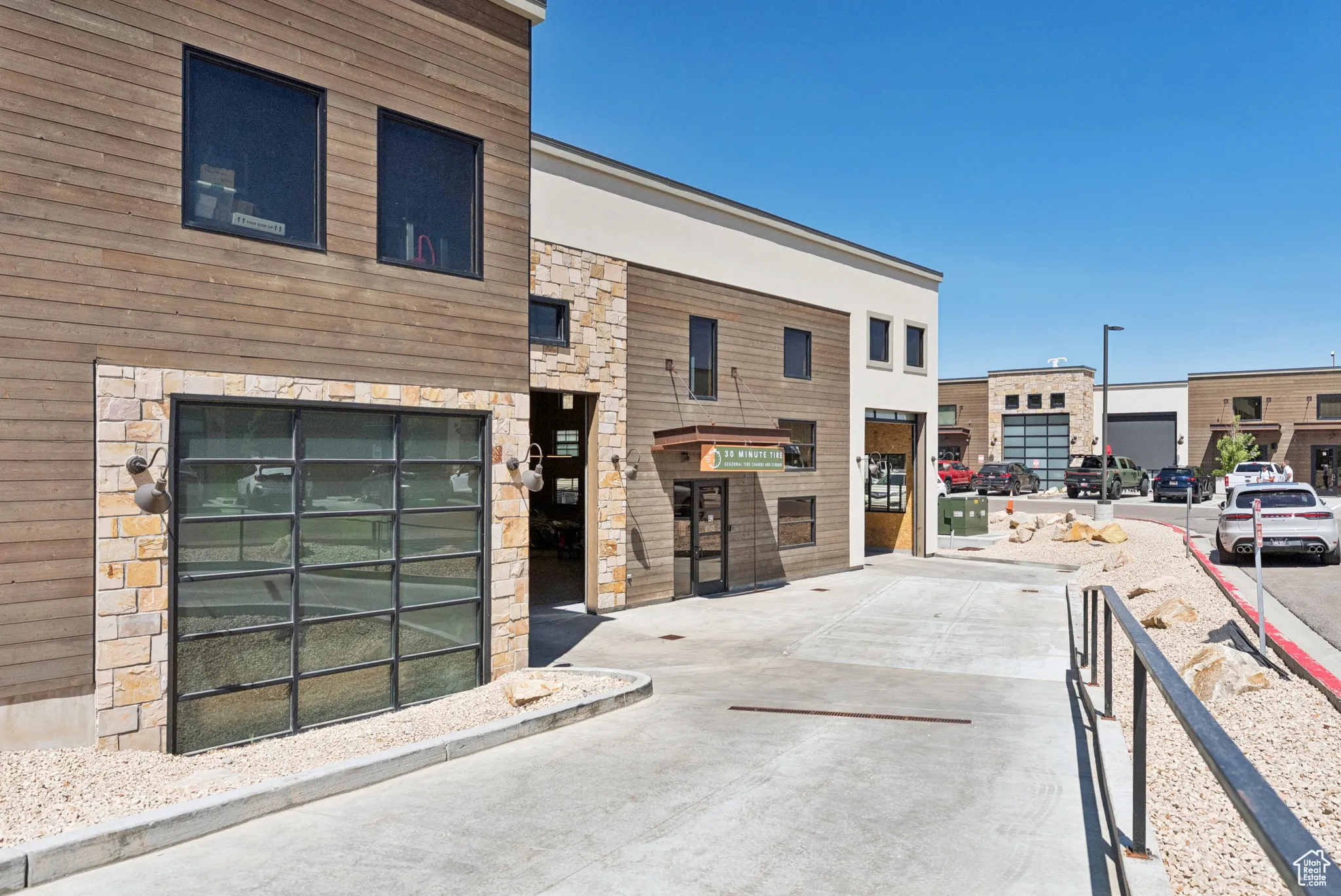 View of building exterior featuring driveway