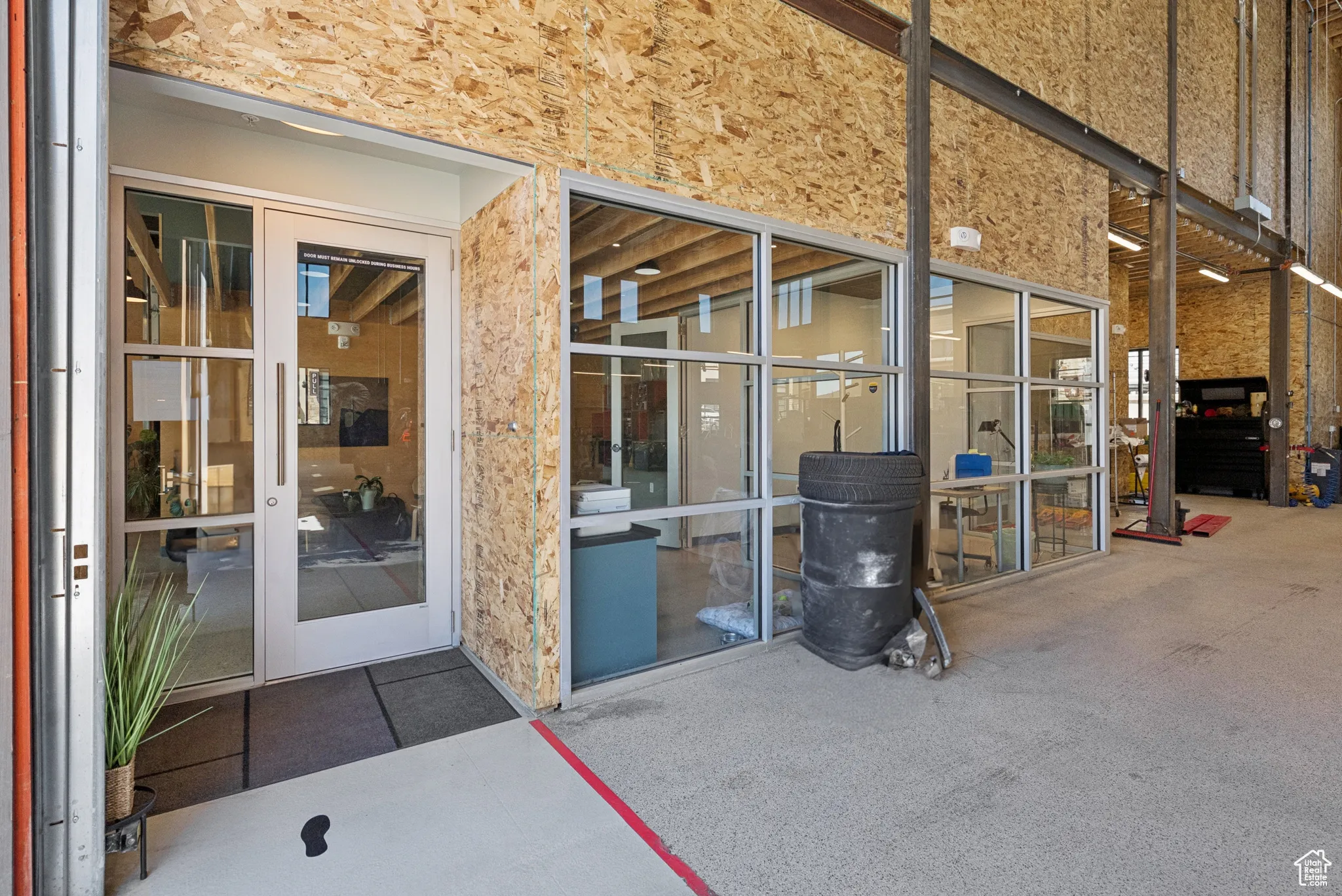 Property entrance with a patio