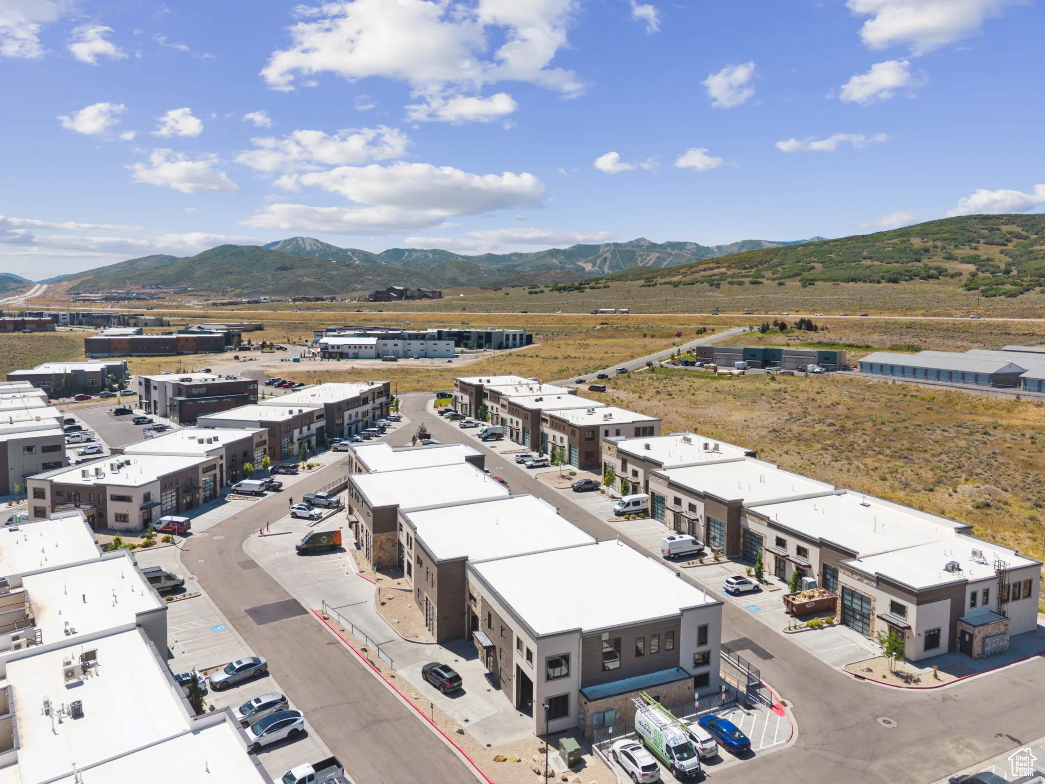 Drone / aerial view of industrial structures and mountains