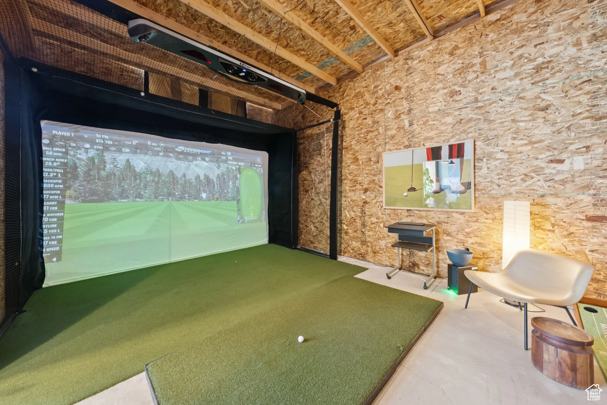 Rec room with golf simulator