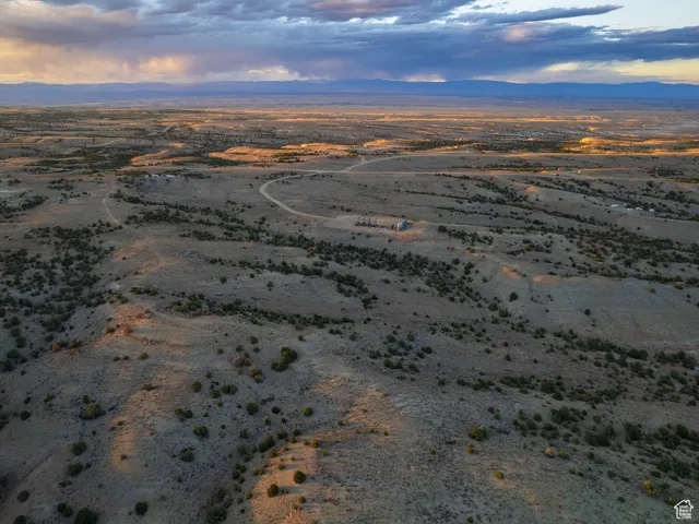 Aerial view of sparsely populated area featuring a desert landscape and mountains