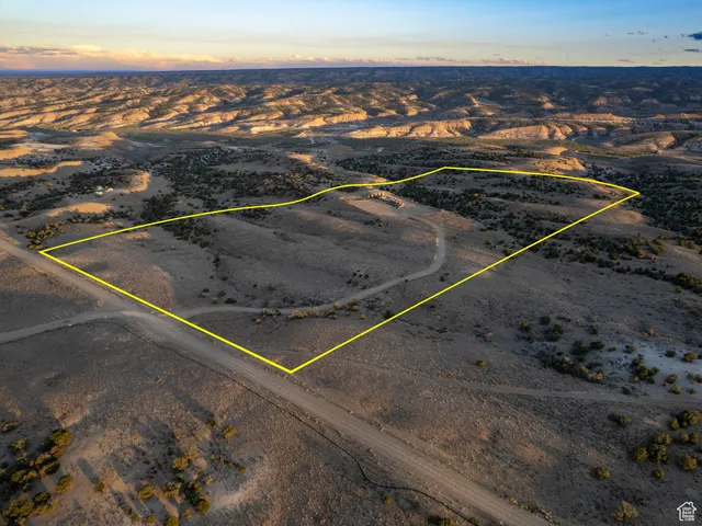 Aerial view of sparsely populated area featuring property boundaries highlighted