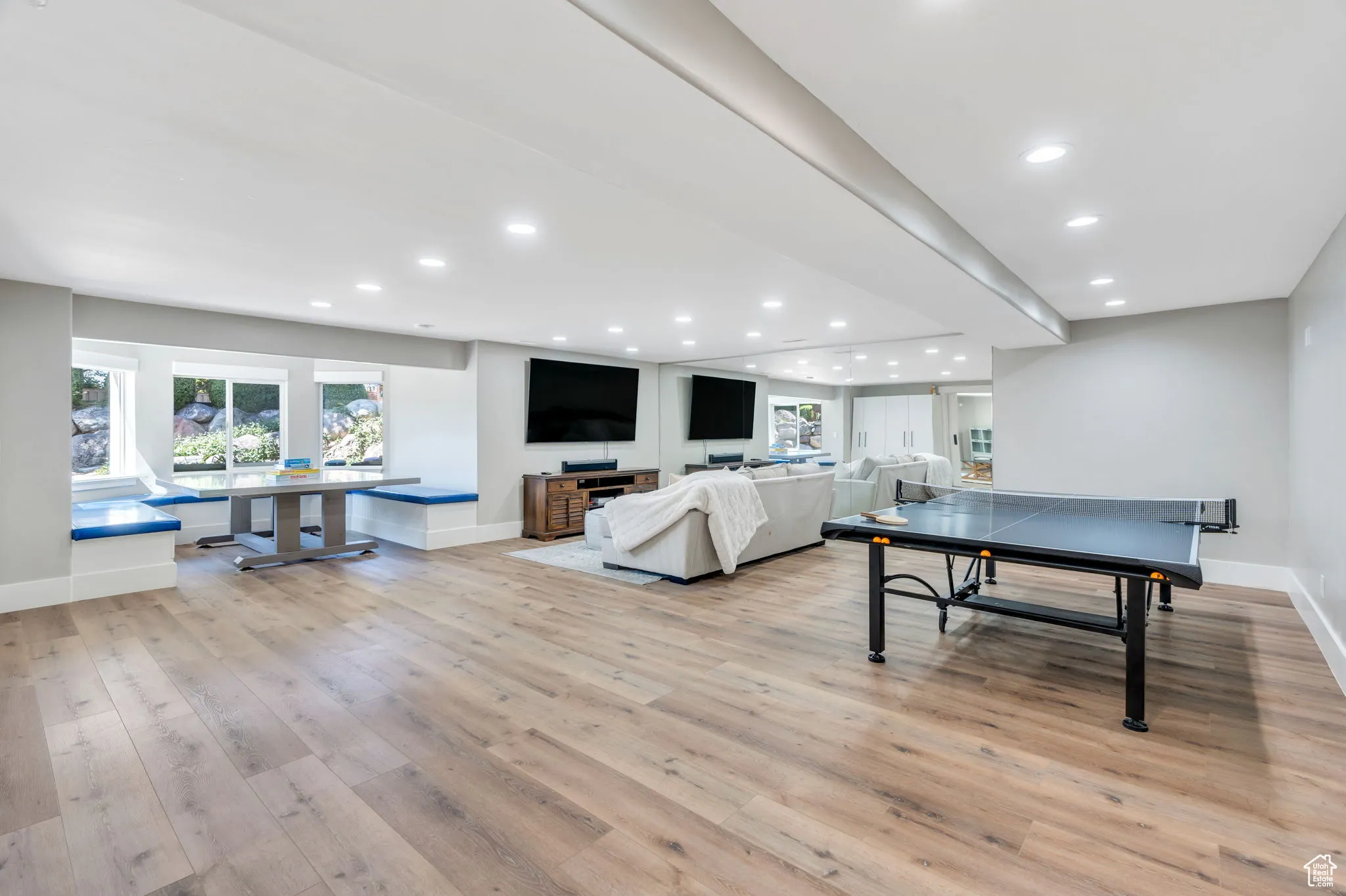 Game room with recessed lighting and light wood-type flooring