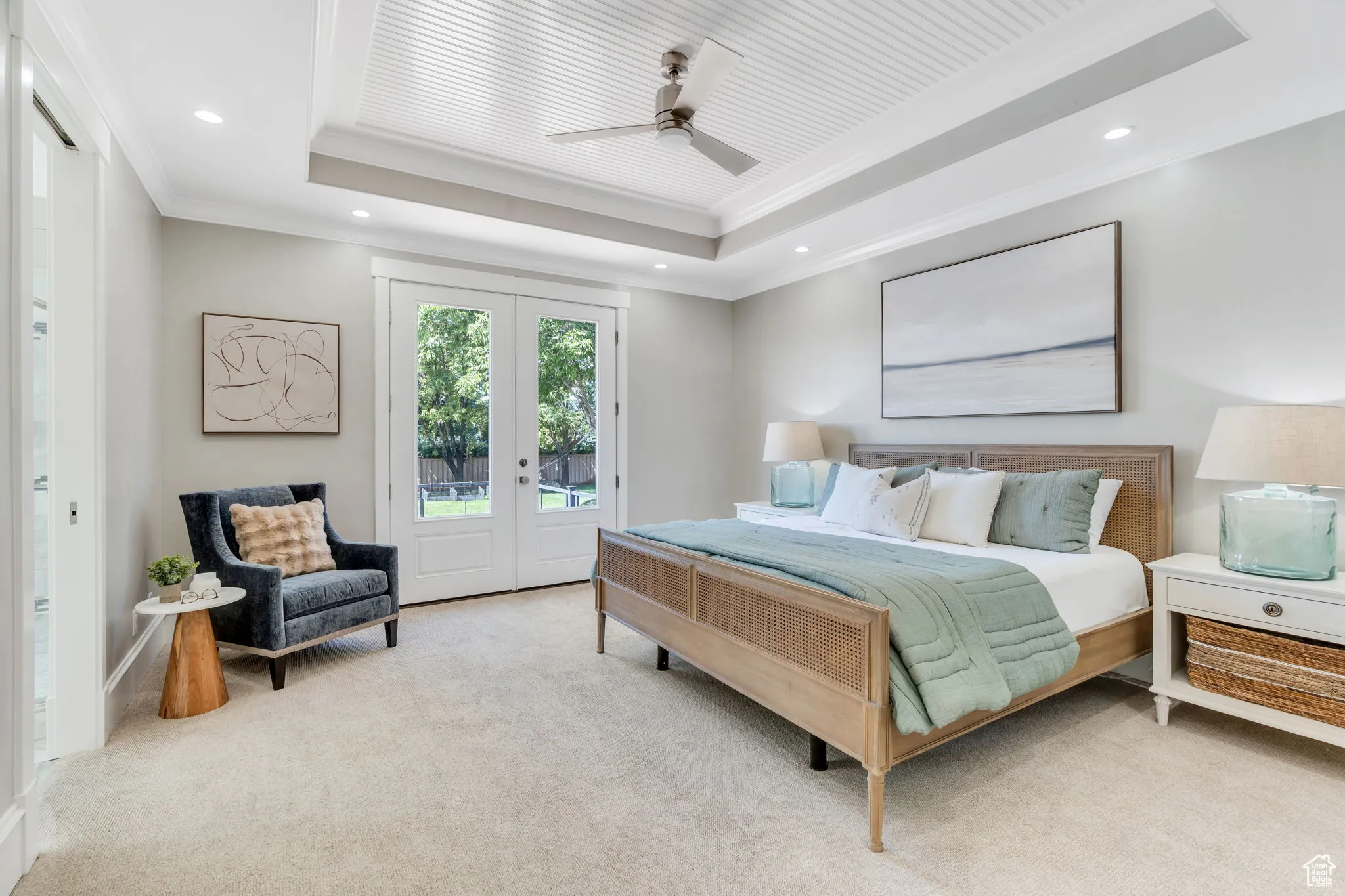 Carpeted bedroom with access to outside, crown molding, french doors, a tray ceiling, and ceiling fan